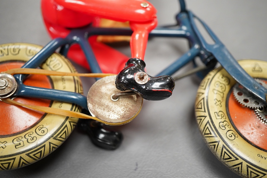 An early boxed Tri-ang Gyro-Cycle, with a gyroscope contained within the front wheel of the bicycle, providing power to the toy, template bicycle with celluloid rider, the box with original inner card holder and a sealed